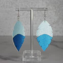 Light Blue Embossed and Blue Glitter Faux Leather Feather Earrings - Front