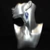 Silver Embossed, Blue Glitter and Leaf Charm Faux Leather Feather Earrings - Head
