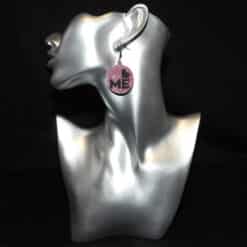 Pink Glitter with Black Love Me Text and Shiny Purple Backing Earrings - Head