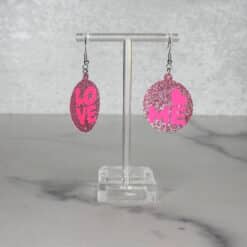 Pink Glitter with Neon Pink Love Me Text and Shiny Purple Backing Earrings - Front