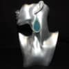 Embossed Teal and Teal Glitter Faux Leather Teardrop Earrings - Head