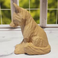 Carved Wood-Style Fox Sitting Sculpture - Left