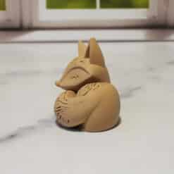 Carved Wood-Style Sleeping Fox Sculpture - Left