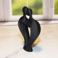 Romantic Couple with Heart Sculpture - Left